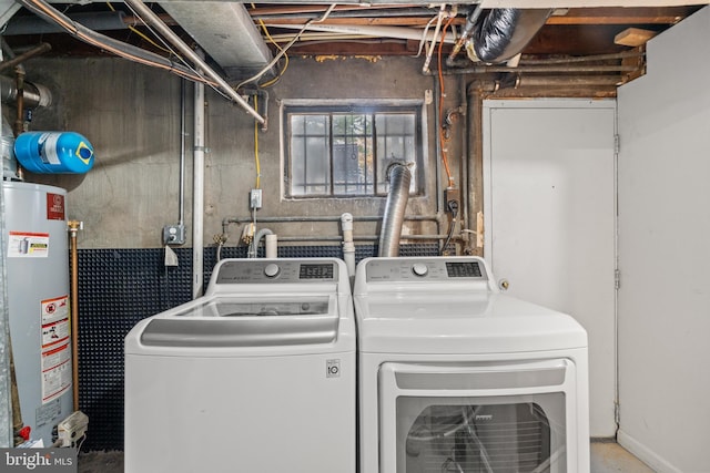 washroom featuring washer and clothes dryer and water heater