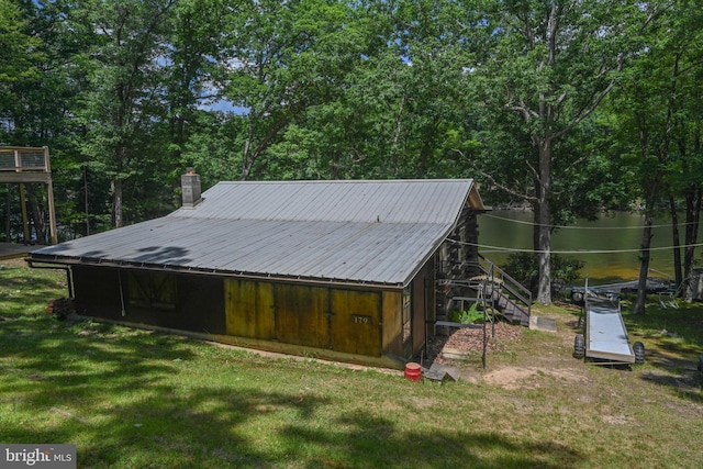 view of outbuilding with a lawn