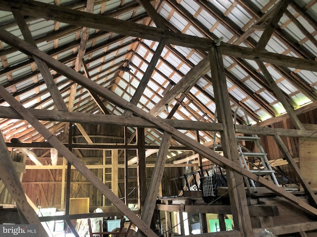 misc room featuring lofted ceiling with beams