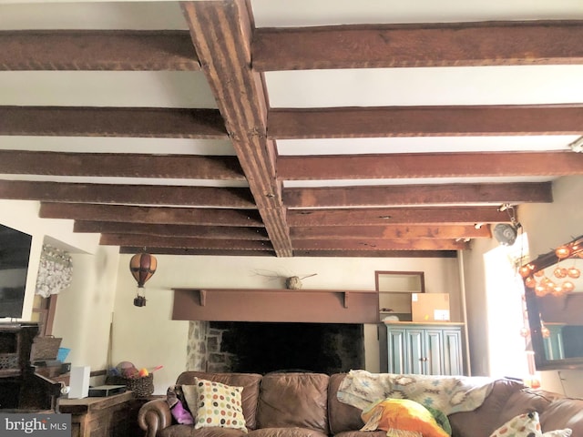 living room with beam ceiling