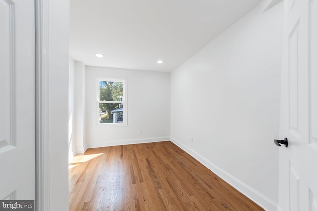 empty room with light hardwood / wood-style floors