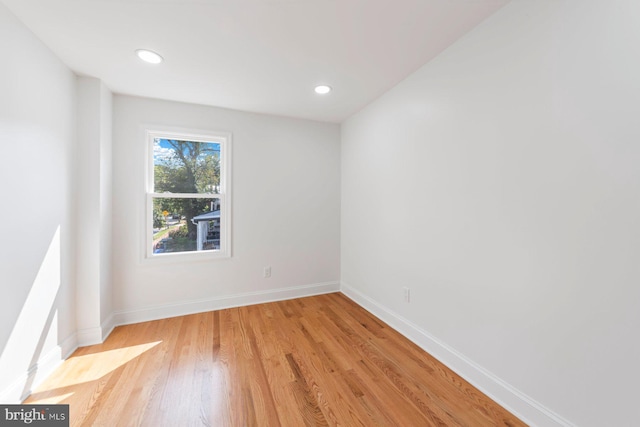 spare room with light hardwood / wood-style flooring