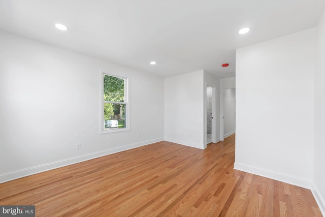 unfurnished room with light hardwood / wood-style flooring