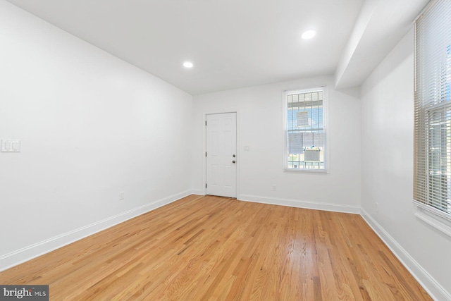 unfurnished room with light hardwood / wood-style flooring