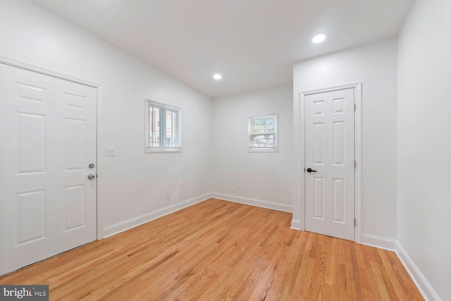 empty room with light hardwood / wood-style floors