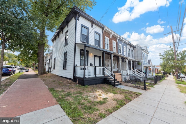 townhome / multi-family property with covered porch