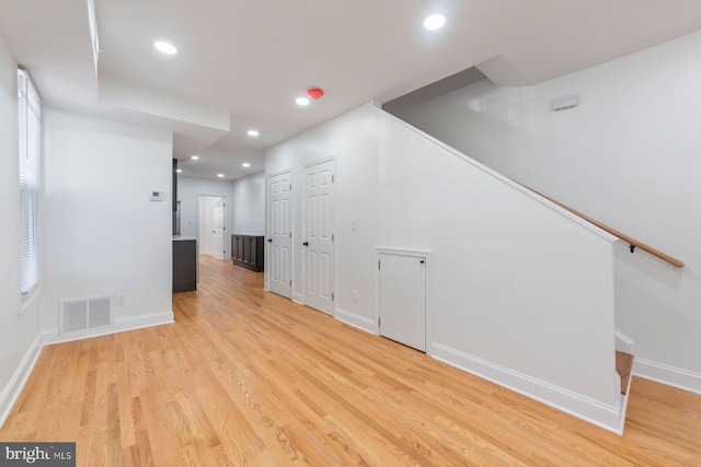 empty room with light hardwood / wood-style floors