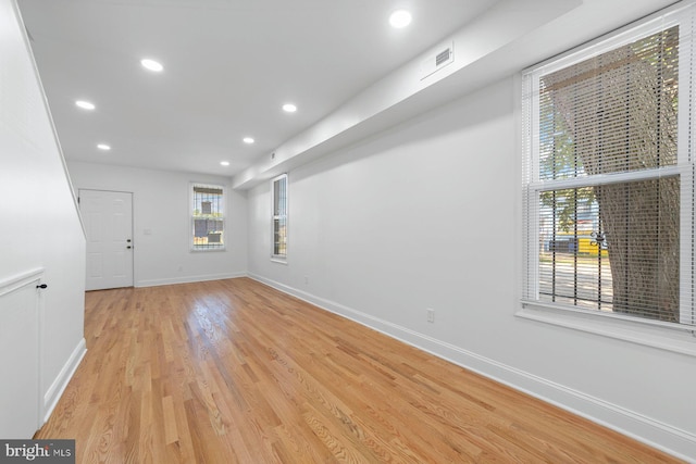 spare room featuring light wood-type flooring