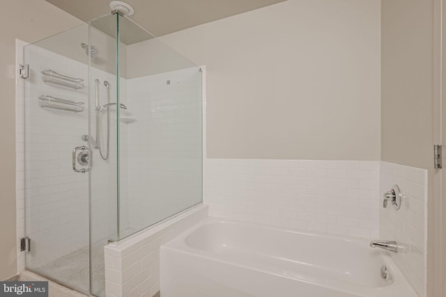 bathroom with separate shower and tub