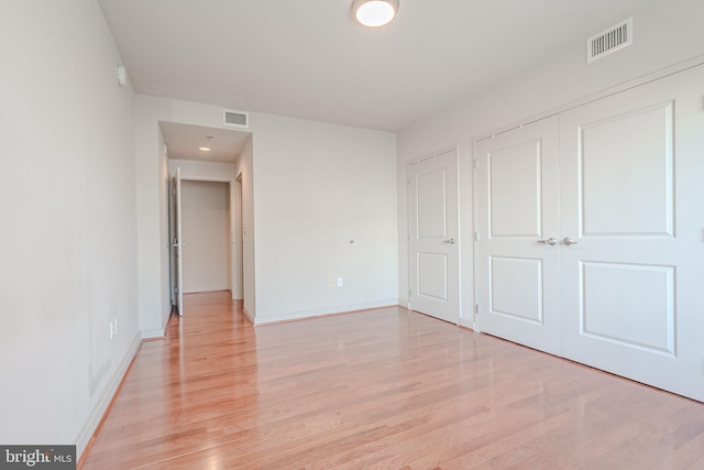 unfurnished bedroom with light hardwood / wood-style floors