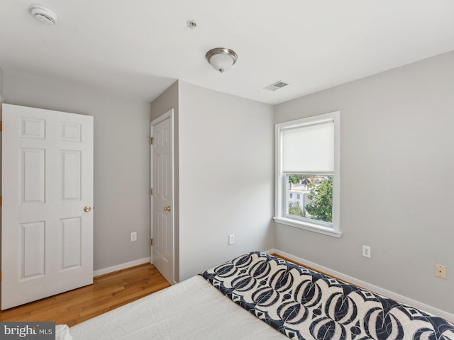 bedroom featuring wood-type flooring