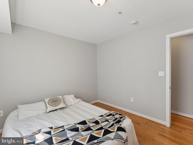 bedroom featuring hardwood / wood-style flooring