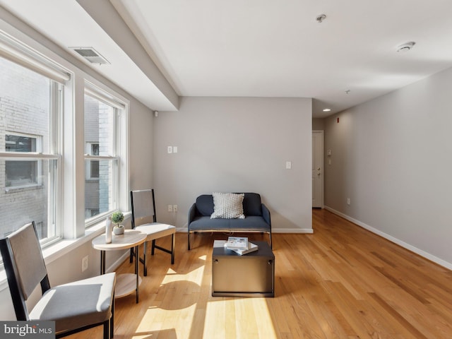 living area featuring light hardwood / wood-style floors