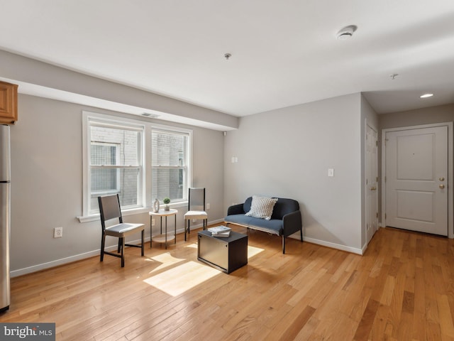 sitting room featuring light wood-type flooring