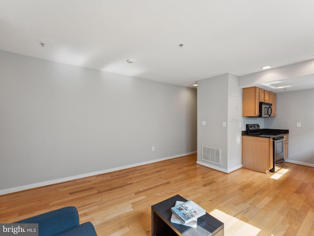 unfurnished living room with light hardwood / wood-style floors