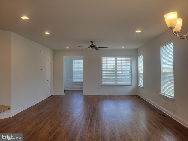 unfurnished room featuring dark hardwood / wood-style floors and ceiling fan