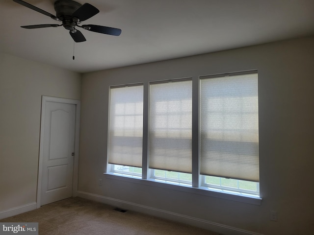 carpeted empty room with ceiling fan