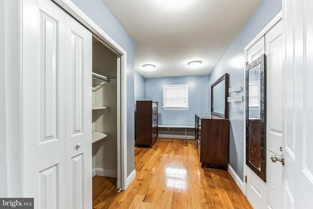 hallway with light wood-type flooring