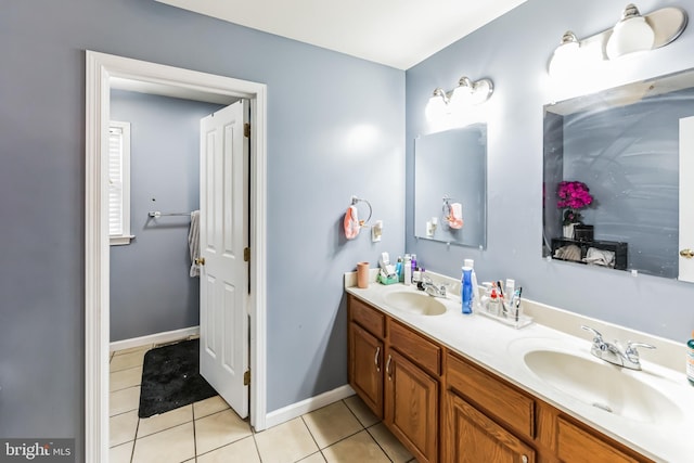 bathroom featuring tile patterned flooring and double sink vanity