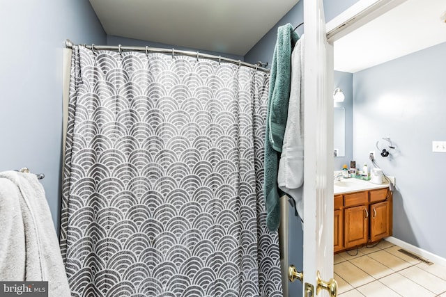 bathroom with vanity and tile patterned flooring