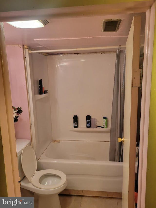 bathroom with tile patterned floors and toilet