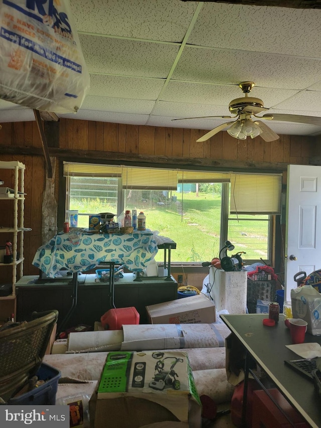 sunroom / solarium featuring a paneled ceiling and ceiling fan