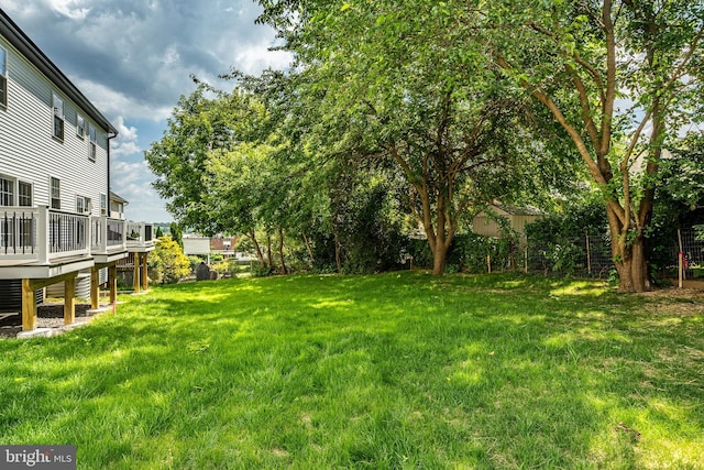 view of yard with a wooden deck