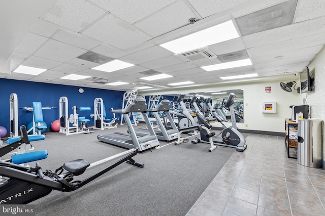 workout area with a drop ceiling