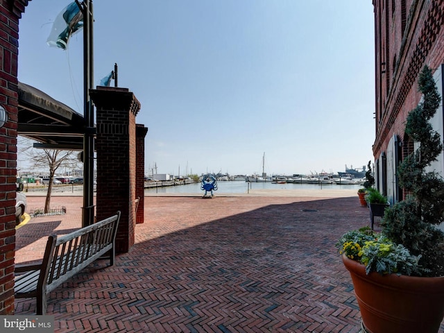 view of patio featuring a water view