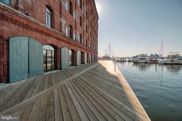 dock area with a water view