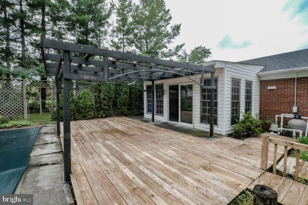 wooden terrace with a pergola