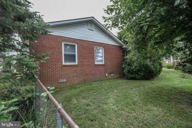 view of home's exterior featuring a yard