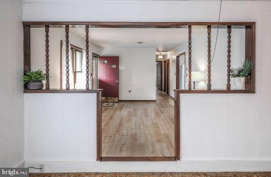 kitchen with hardwood / wood-style flooring and a textured ceiling