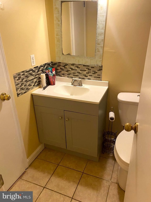 1184 Bannister Cir, Waldorf, MD 20602 - half bathroom with toilet, vanity, decorative backsplash, and tile patterned floors