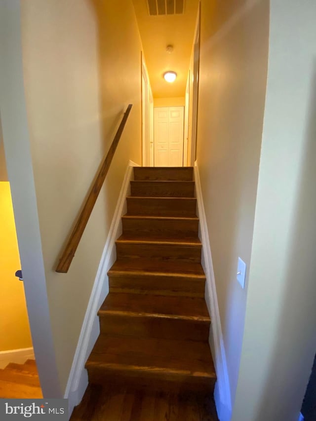 1184 Bannister Cir, Waldorf, MD 20602 - stairway featuring wood finished floors and baseboards