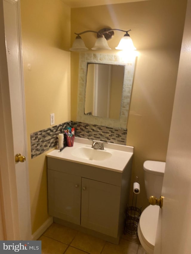 1184 Bannister Cir, Waldorf, MD 20602 - bathroom with vanity, toilet, tile patterned floors, and decorative backsplash