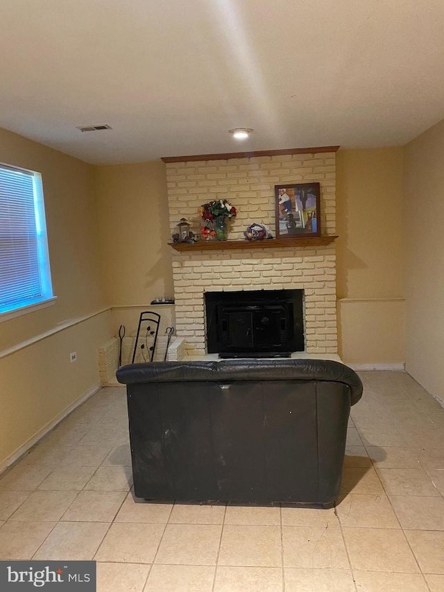 1184 Bannister Cir, Waldorf, MD 20602 - living area featuring a brick fireplace, light tile patterned floors, and baseboards