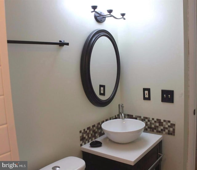 1184 Bannister Cir, Waldorf, MD 20602 - half bathroom featuring backsplash, vanity, and toilet