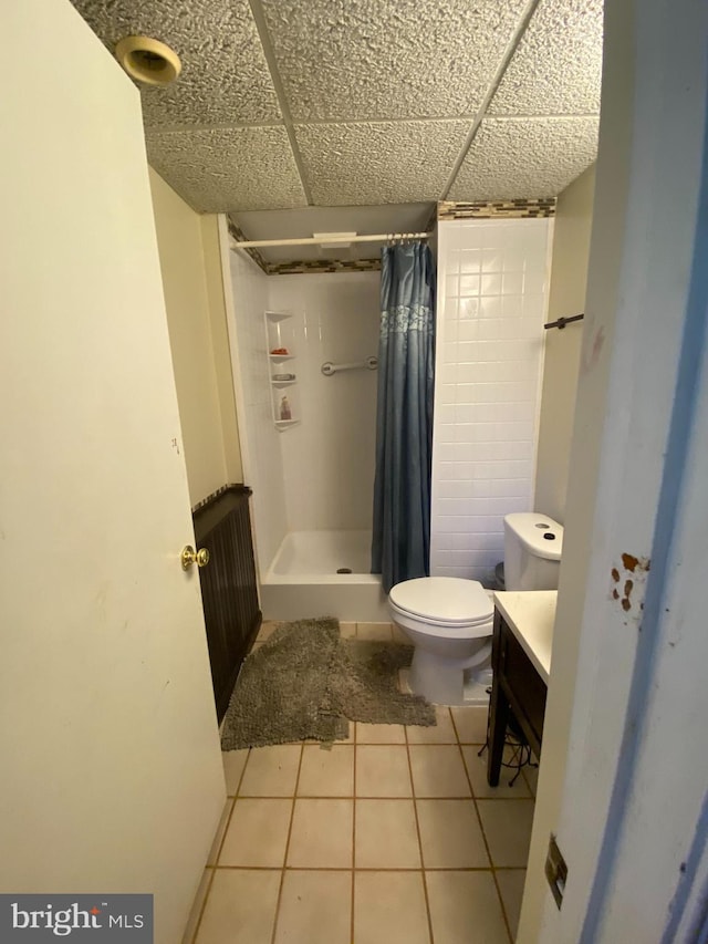 1184 Bannister Cir, Waldorf, MD 20602 - bathroom featuring toilet, a stall shower, vanity, tile patterned flooring, and a paneled ceiling