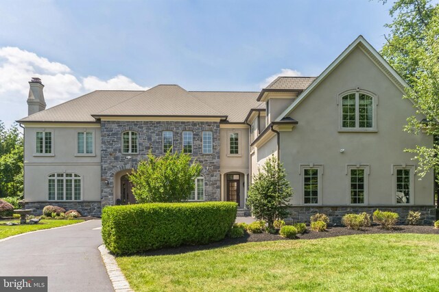 view of front of home with a front yard