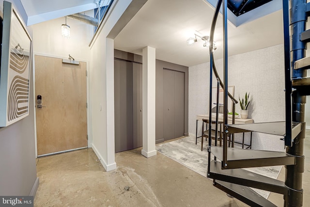 entryway with concrete floors