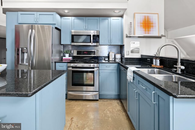 kitchen with stainless steel appliances, blue cabinets, a sink, and decorative backsplash