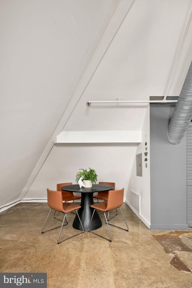 dining area with baseboards, electric panel, visible vents, and concrete flooring