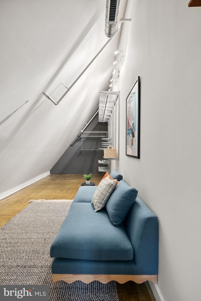 interior space featuring visible vents, baseboards, and wood finished floors