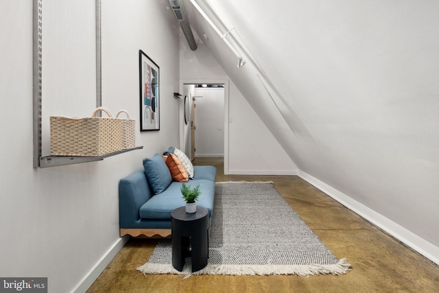 living area featuring vaulted ceiling