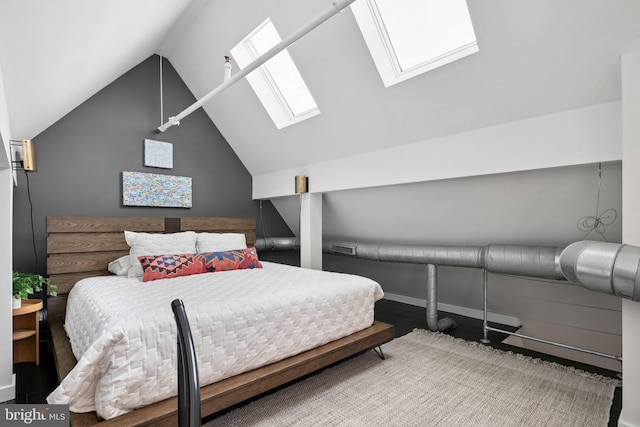 bedroom featuring lofted ceiling with skylight