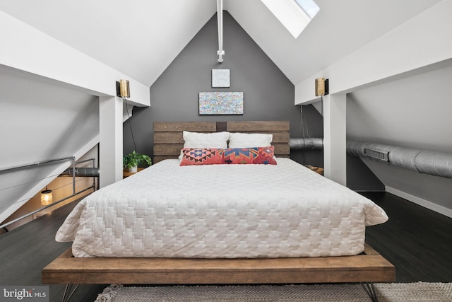 bedroom featuring vaulted ceiling with skylight and wood-type flooring