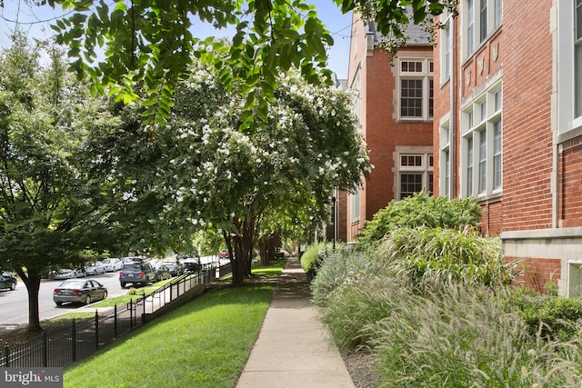 view of property's community with a yard