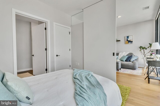 bedroom featuring light wood-type flooring