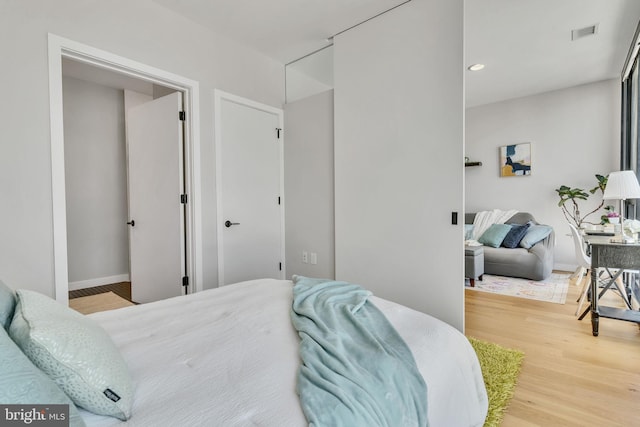 bedroom with light hardwood / wood-style flooring